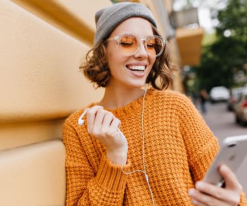 Smiling woman studying online outdoors